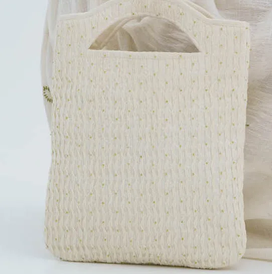 White handloom cotton smocked beaded bag